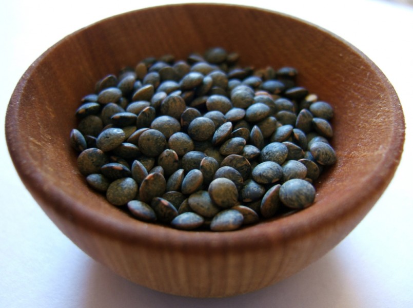 Puy lentils in wood bowl