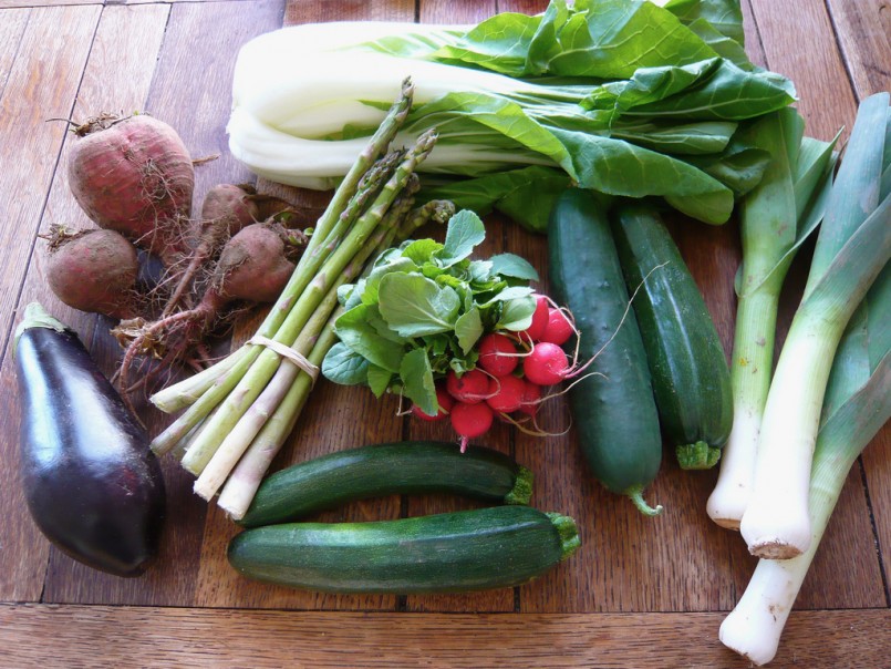 assorted organic vegetables on wood table