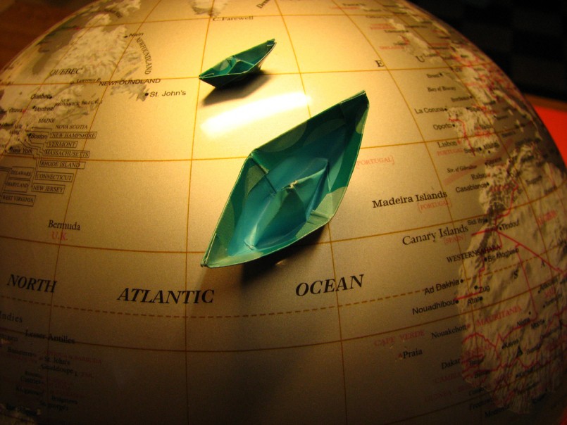 paper boats on a globe