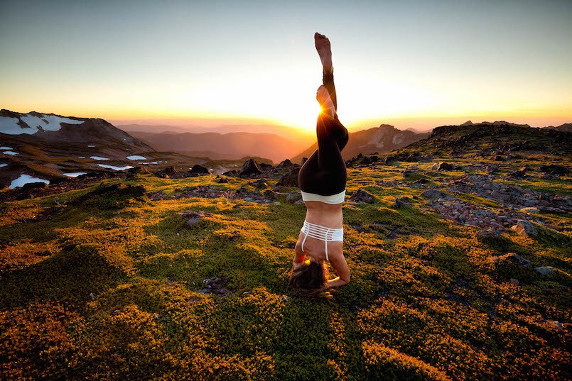 outdoor yoga woman in headstand