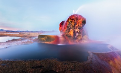 fly geyser near the black rock desert in nevada constantly erupts minerals and hot water creating bright colors and terraced pools