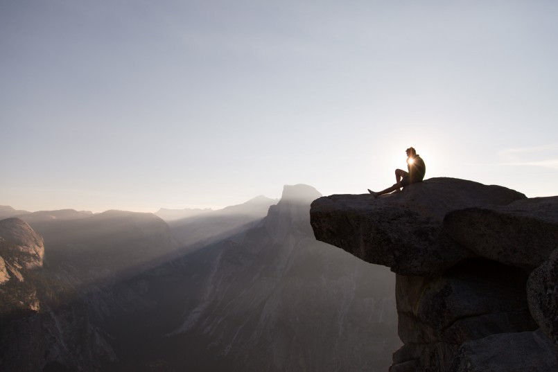 rock climber sitting on ledge in Yosemite national park