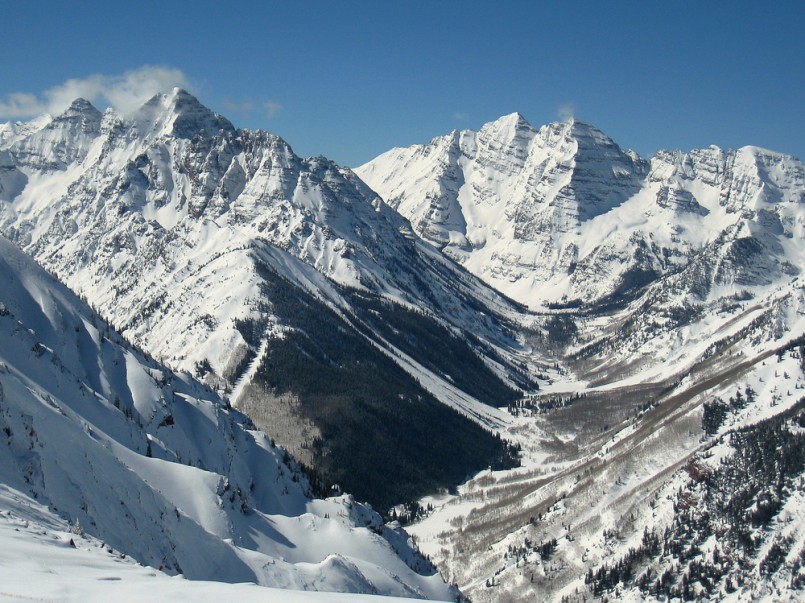 A view up the Maroon Creek Valley seen from the top of Aspen Highlands. On display are three of Colorado’s fourteeners: (L to R) Pyramid Peak, South and North Maroon Peak.