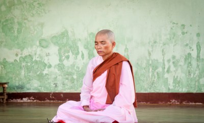 Buddhist nun praying for the full moon festival, Shwedagon Pagoda