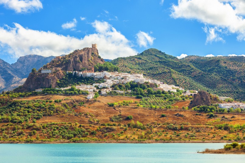 Panoramic of Zahara de la Sierra over Guadalete river (forming Zahara reservoir). Typical white town in the province of Cadiz, Spain