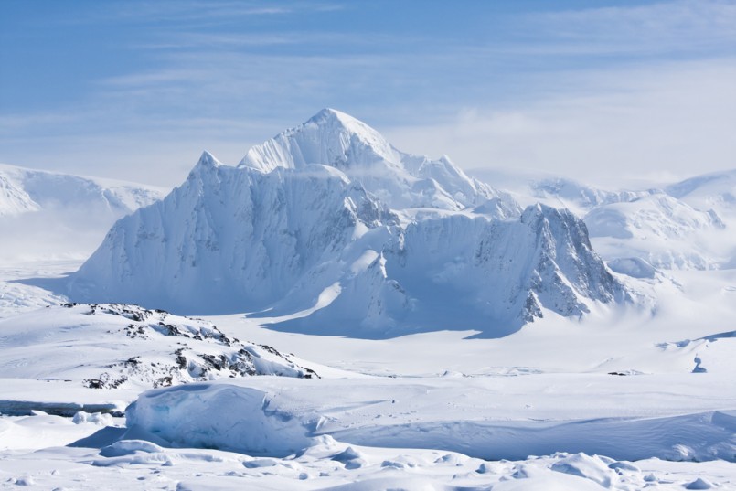 mountain peak is covered with white snow in Antarctica