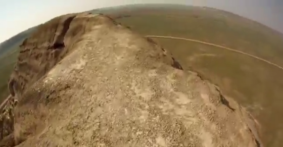 Daredevil rides unicycle over 200-foot cliff