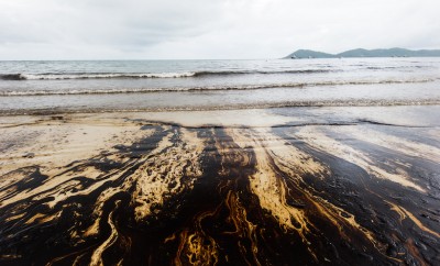 crude oil on oil spill accident on Ao Prao Beach at Samet island on July 31,2013 in Rayong,Thailand