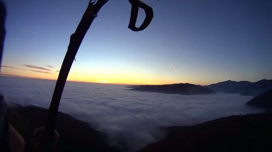Ocean of clouds while paragliding over Carpathian Mountains