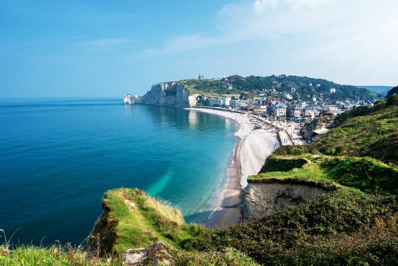 View from the famous white cliffs of Etretat on the beach and the village, Alabaster Coast, Normandy