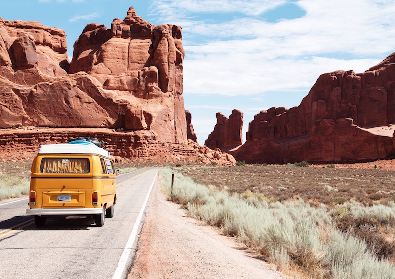 yellow-van-driving-road-trip-west-america-southewest-arizona-utah